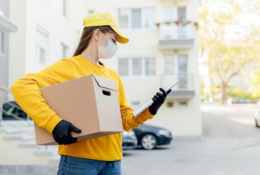 medium-shot-delivery-woman-holding-box